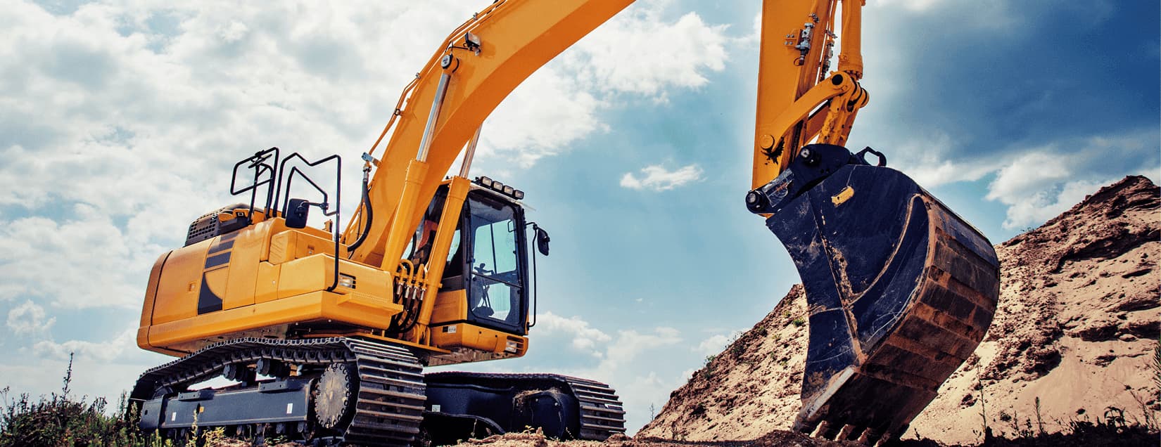 excavator and articulated truck